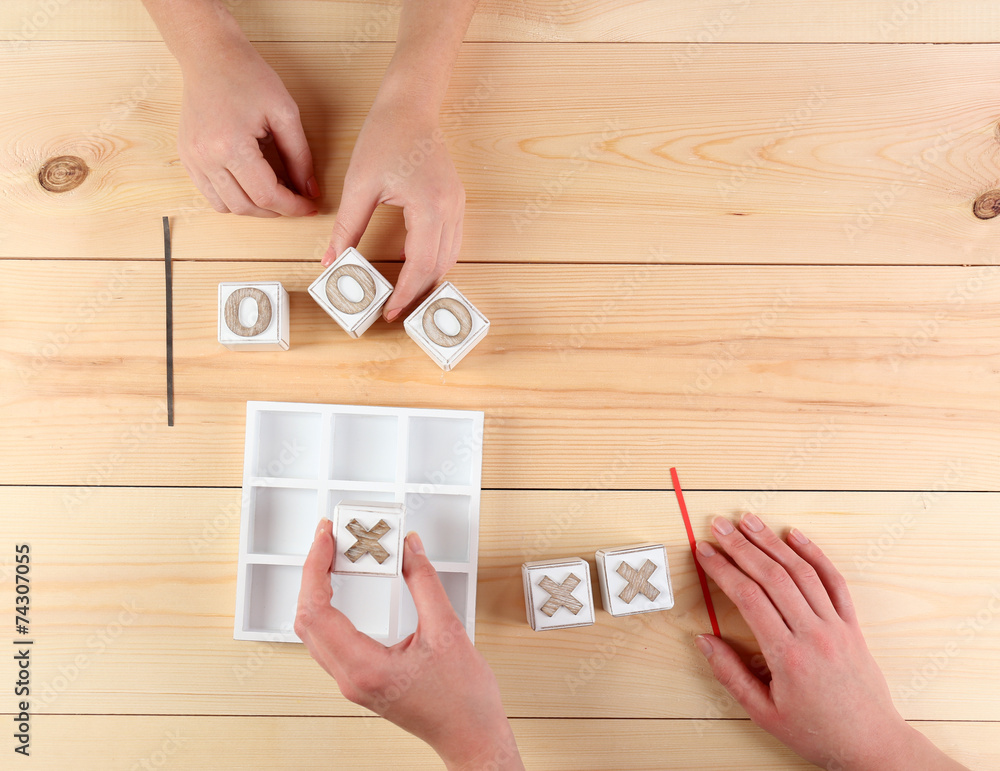 Game of Tic Tac Toe on wooden background