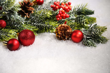 Wall Mural - Christmas composition with baubles and fir-tree on snow