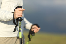 Close Up Of A Hiker Hands Walking With Poles