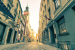 Vintage retro postcard of a narrow medieval street in Riga