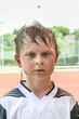 © travelview - boy exhausted from playing football