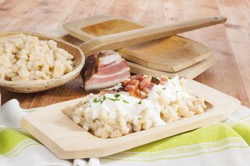 Wall Mural - Traditional slovak eating, bryndzove halusky.