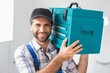 © WavebreakMediaMicro - Plumber holding toolbox on shoulder