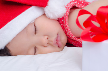 Wall Mural - Sleeping baby girl Santa Claus