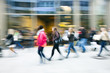 © FotoKachna - A shopper walking past a store window