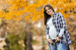 © BGStock72 - Young pregnant woman in the autumn park