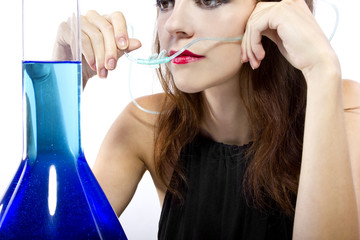 woman inhaling flavored oxygen with cannula and scented water