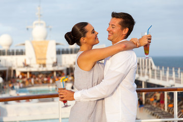 Wall Mural - lovely couple embracing on cruise ship