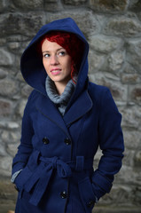 Wall Mural - Redhead girl in blue coat