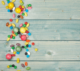 Wall Mural - Candies lying over the wooden surface