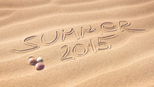 Summer 2015 Handwriting With Shells On A Wavy Pattern Of Sand