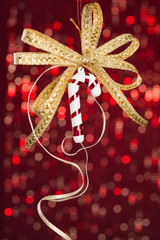 Poster - Golden candy cane on shiny background