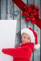 Wall Mural - Composite image of festive little girl showing poster