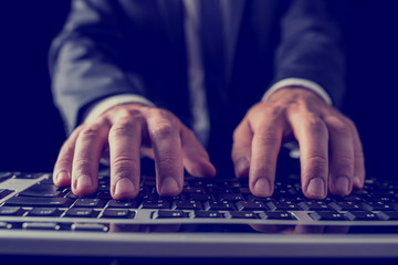 Wall Mural - businessman typing on computer keyboard