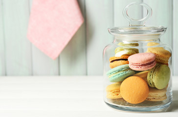 Wall Mural - Gentle colorful macaroons in glass jar