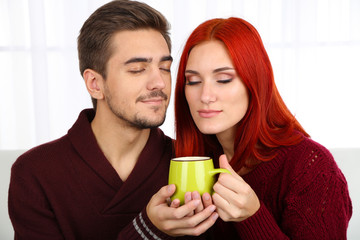 Poster - Loving couple with hot drink