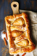Tasty homemade pear pie on wooden table
