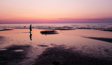 Sunset On The Beach And Silhouette Of Man, Jurmala