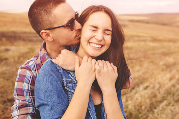 Landscape portrait of young beautiful stylish couple sensual and