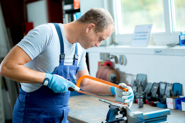 Wall Mural - worker on work bench in the factory