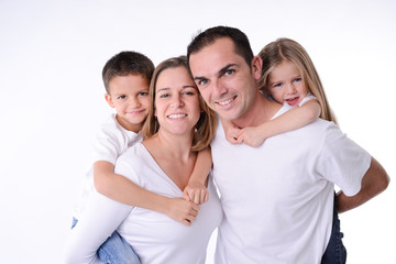 Wall Mural - isolated studio shot happy family of four with little kids