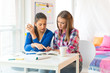 © Stock Rocket - Two female students learning at home
