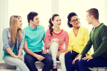 Sticker - five smiling teenagers having fun at home