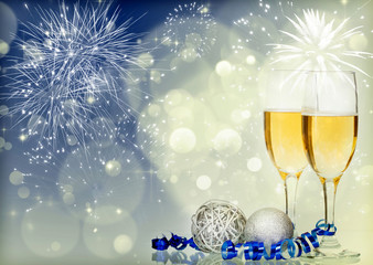 Glasses with champagne and Christmas decoration on sparkling hol