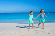 © travnikovstudio - Little girls having fun during tropical beach vacation