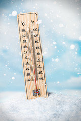 thermometer on snow shows low temperatures