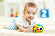 © Oksana Kuzmina - baby boy playing with toys indoor