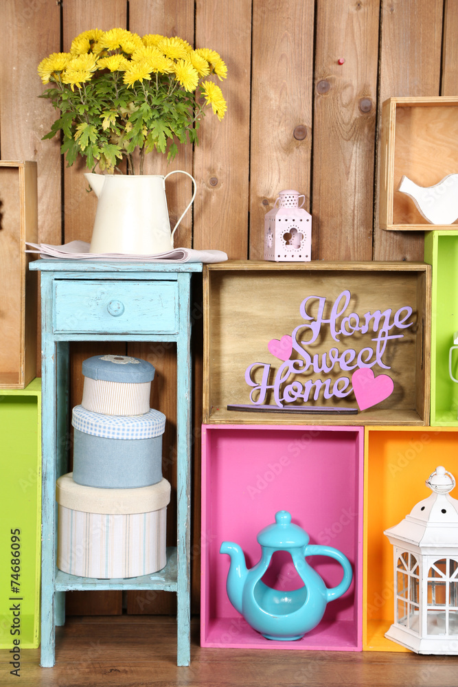 Beautiful colorful shelves with different home related objects
