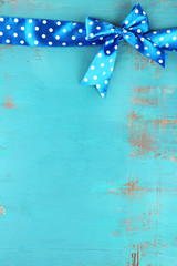 Wall Mural - Old wooden background with beautiful bow