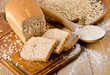 Bread and flour on wooden background