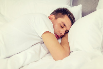 Canvas Print - handsome man sleeping in bed