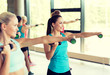 © Syda Productions - group of women with dumbbells in gym