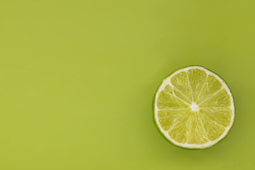 Lime slice on a green background