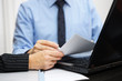 © Bacho Foto - Consultant and client are working with documents and laptop on o