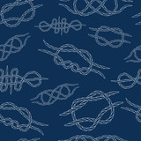 Seamless background of knots. Hand drawn. Contours. Vector