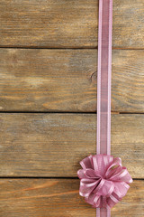 Wall Mural - Old wooden background with beautiful bow