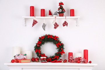 Canvas Print - Christmas decorations on mantelpiece on white wall background