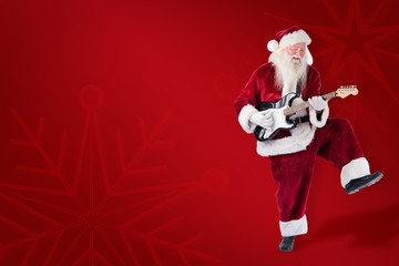 Poster - Composite image of santa claus has fun with a guitar