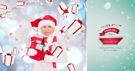 Poster - Composite image of festive woman holding gifts