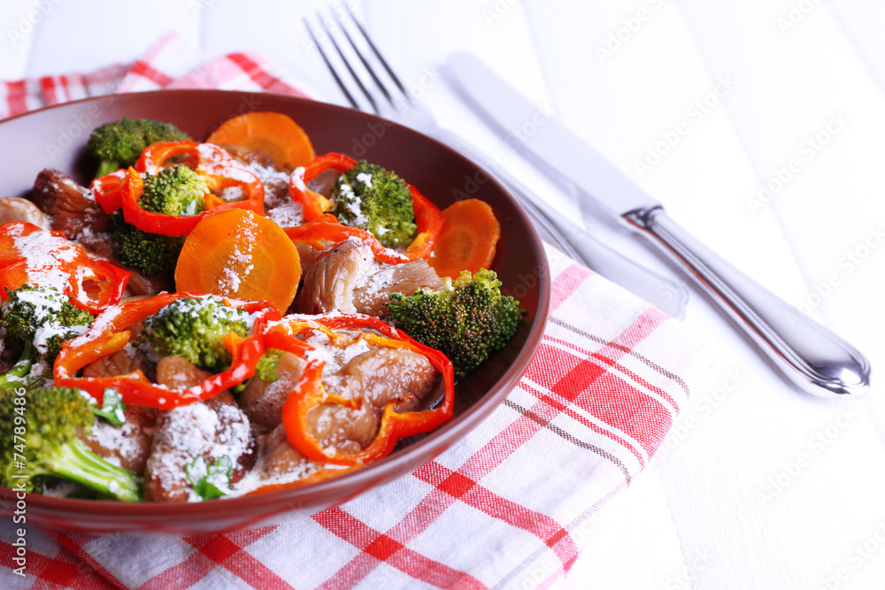 Braised wild mushrooms with vegetables and sauce in plate