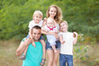 © zagorodnaya - portrait of a happy family on summer nature