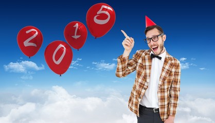 Poster - Composite image of geeky hipster in party hat pointing