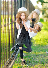 Wall Mural - portrait of a two beautiful fashion little girl