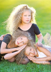 Wall Mural - portrait of a three beautiful fashion little girls