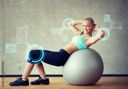 Naklejka - mata magnetyczna na lodówkę smiling woman with exercise ball in gym