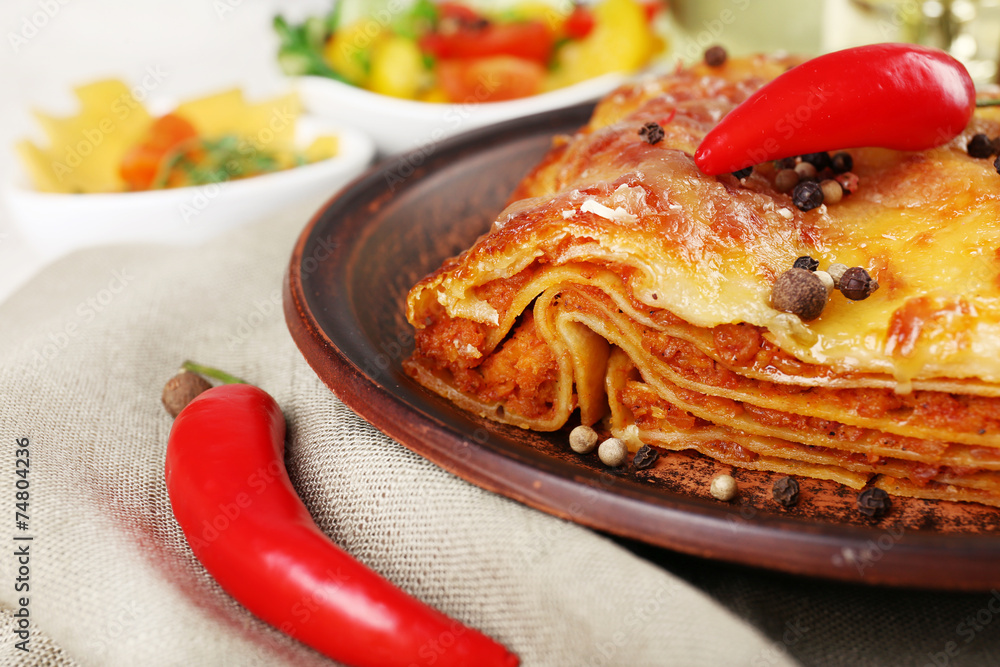 Portion of tasty lasagna on table